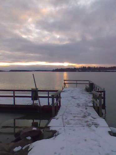sunset and snow on pier