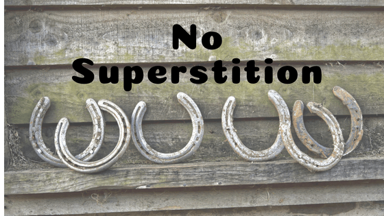 horse shoes against wooden wall