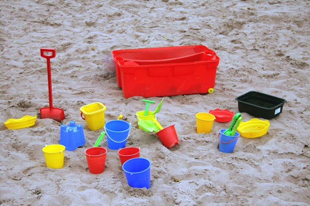 spades and buckets on sand